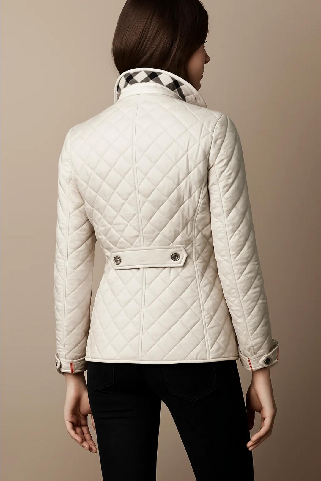 Back view of white quilted jacket with waist tab detail