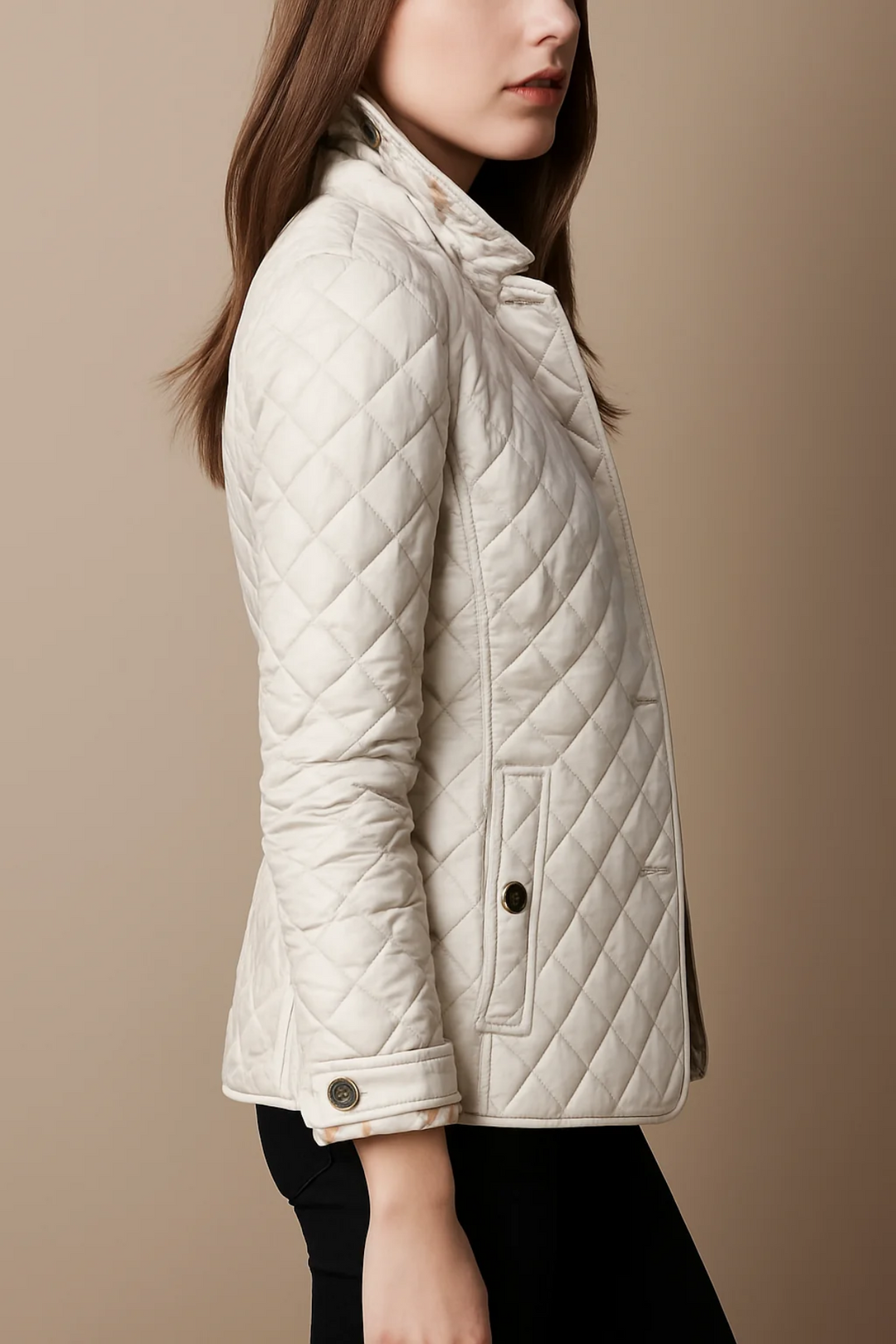 Side view of white quilted jacket showing pocket detail