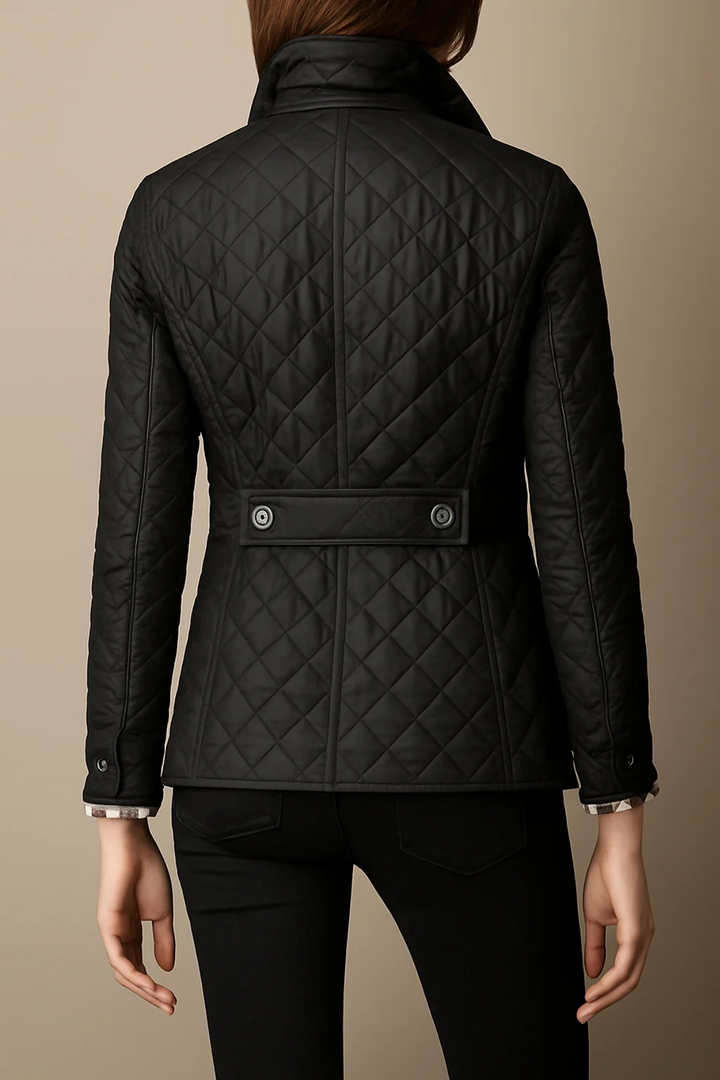 Back view of black quilted jacket with waist tab detail